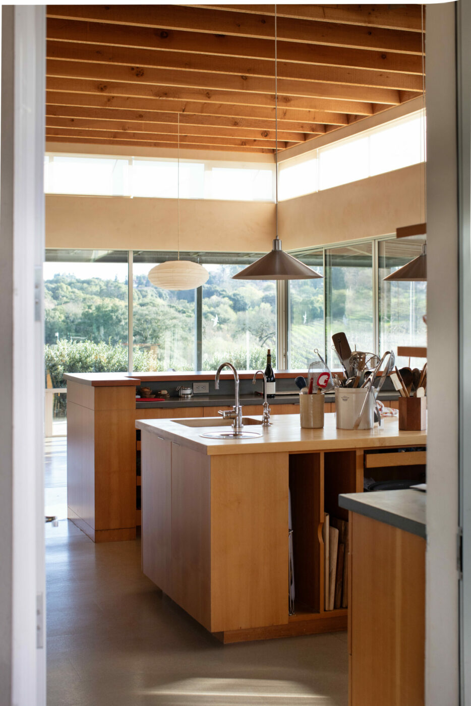 A thoughtful connection to the outdoors and lots of space for cooking anchor the clean-lined, modernist main home. “In many ways, my house is a large kitchen with some bedrooms around it,” Stephen Singer explains. (Eileen Roche / Sonoma Magazine)