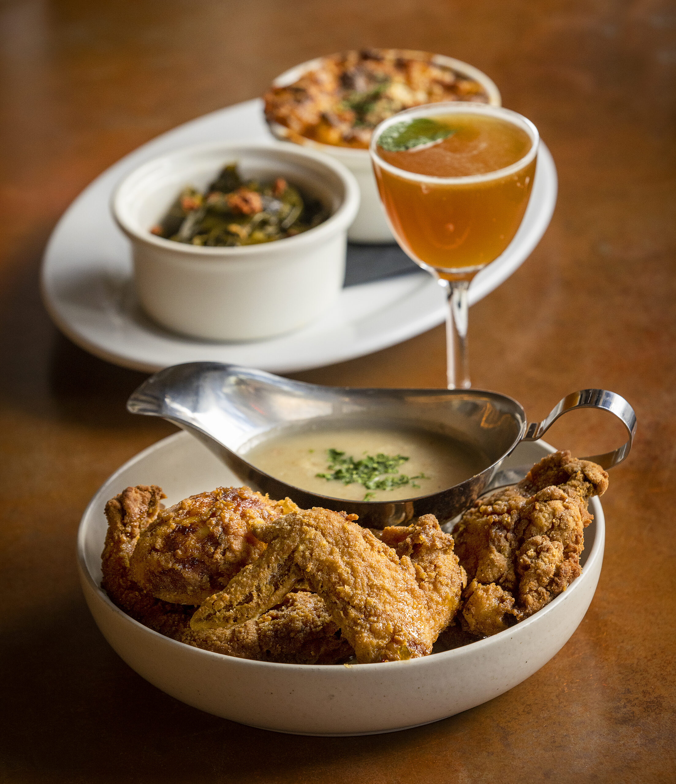 Southern Fried Chicken Dinner with leftover collards, mac and cheese, bacon truffle gravy and Calabrian chili honey with The Derby Cocktail from Easy Rider in Petaluma. (John Burgess/The Press Democrat)