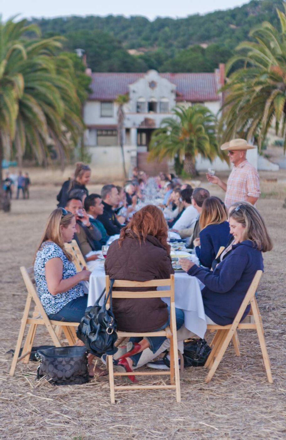 An Outstanding in the Field dinner at Scribe Winery. Another one is slated for the artisnal winery on May 28, 2014, with Chef Thomas McNaughton of Flour+Water in SF. OITF founding chef/artist Jim Denevan is shown with the hat standing to the right of the table. Photo: Ilana Freddye/Outstanding in the Field.