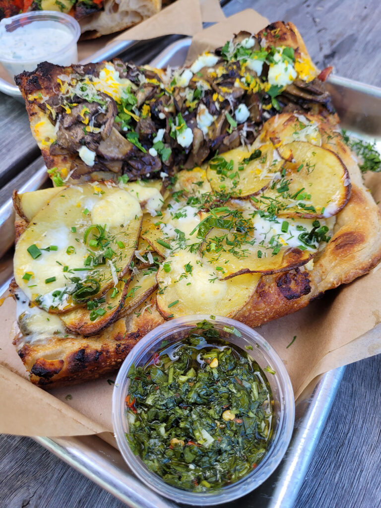 Slices of mushroom and potato pizza with chimichurri at Psychic Pie in Sebastopol. (Heather Irwin/Sonoma Magazine)