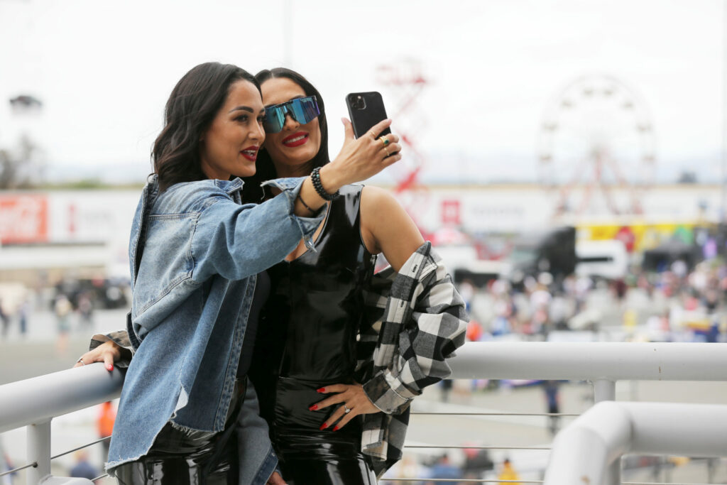 The Bella Twins, former professional wrestling duo, who were the Grand Marshals of the 33rd Annual Toyota/Save Mart 350, record a video at Sonoma Raceway in Sonoma on Sunday, June 12, 2022. (Beth Schlanker/The Press Democrat)
