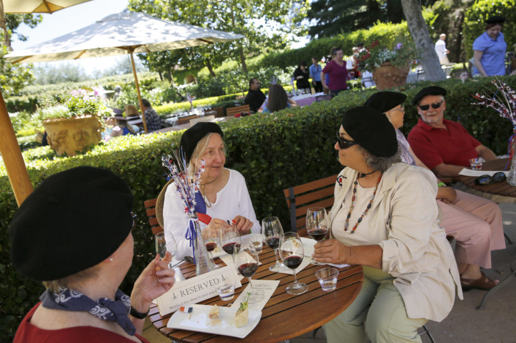 7/15/2013: B2: PC: (From left) Friends Eileen Maloy, Kathy Burke, and Helen Baum, wear berets while celebrating Bastille Day at Chateau St. Jean on Sunday, July 14, 2013 in Kenwood, California. (BETH SCHLANKER/ The Press Democrat)