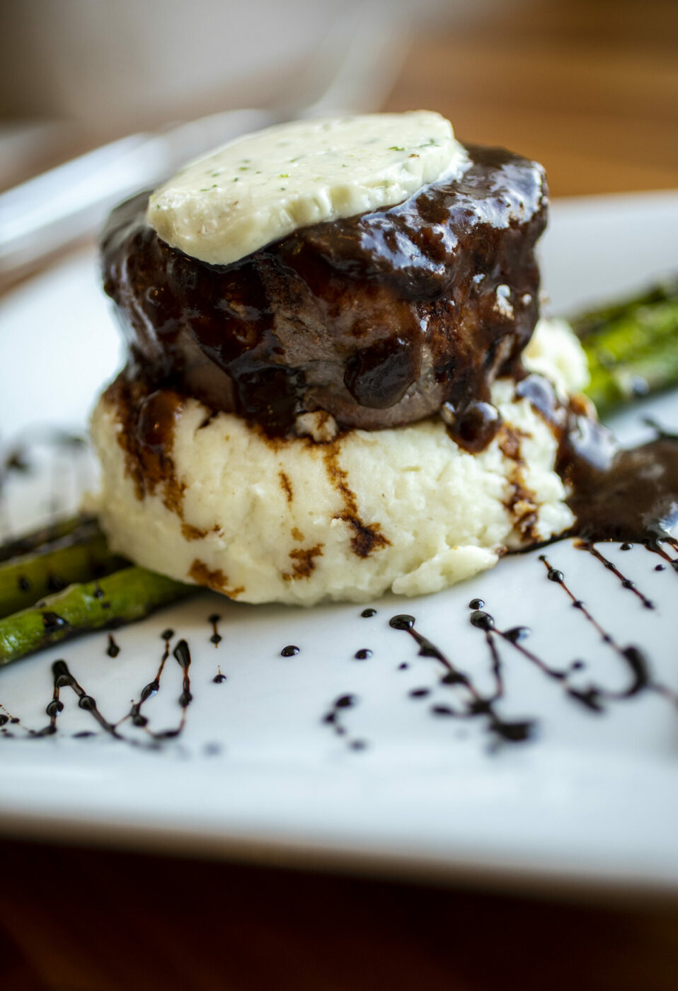 Broiled Filet Mignon served with garlic mashed potatoes, chilled asparagus, and blue cheese butter, at Sonoma Grille in Sonoma on Friday February 4, 2022. (Chad Surmick / The Press Democrat)