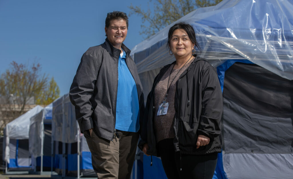 On the left, Michelle Patino, RN, Owner/CEO of DEMA consulting and management, with Administration Drive site manager Monica Flores at the Sonoma County complex, Thursday, April 13, 2023. (Chad Surmick / The Press Democrat)