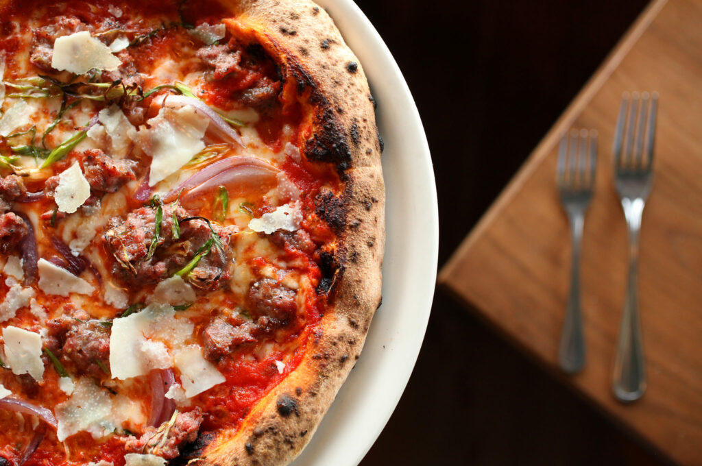 The Salsiccia Pizza, containing house sausage, red onions, and pecorino, at Diavola Pizzeria & Salumeria, in Geyserville. (Christopher Chung/The Press Democrat)