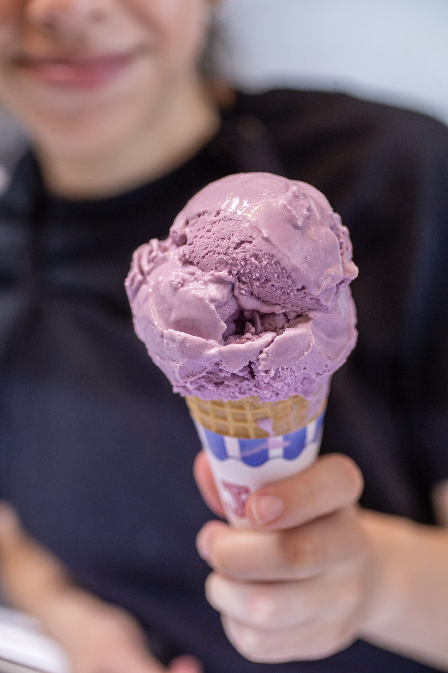 Lavender Angela’s Organic ice cream is served in a sugar cone at Iggy’s Organic Burgers on the plaza in downtown Healdsburg, June 30, 2023. (Chad Surmick / The Press Democrat)