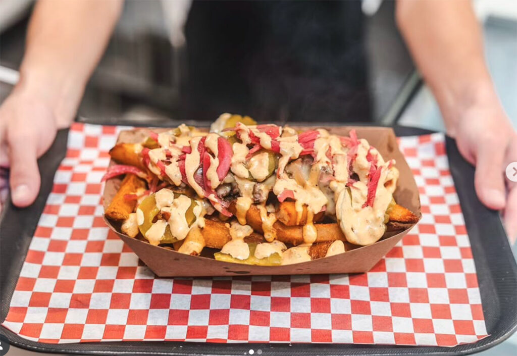 Thick-cut fries with melted cheddar, pickled onions, Iggy’s Million Island saucebeef, cheese, Iggy’s million island sauce, pickles and grass-fed beef. (Kelsey Joy)