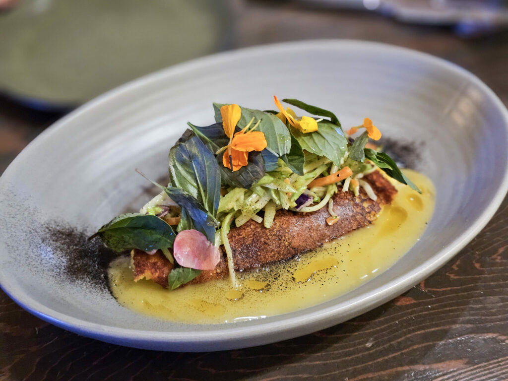 Cachapa, a fresh corn pancake with mozzarella fresco, shaved broccoli salad, and honey lemon vinaigrette at Guiso Latin Fusion restaurant in Healdsburg. (Heather Irwin/The Press Democrat)