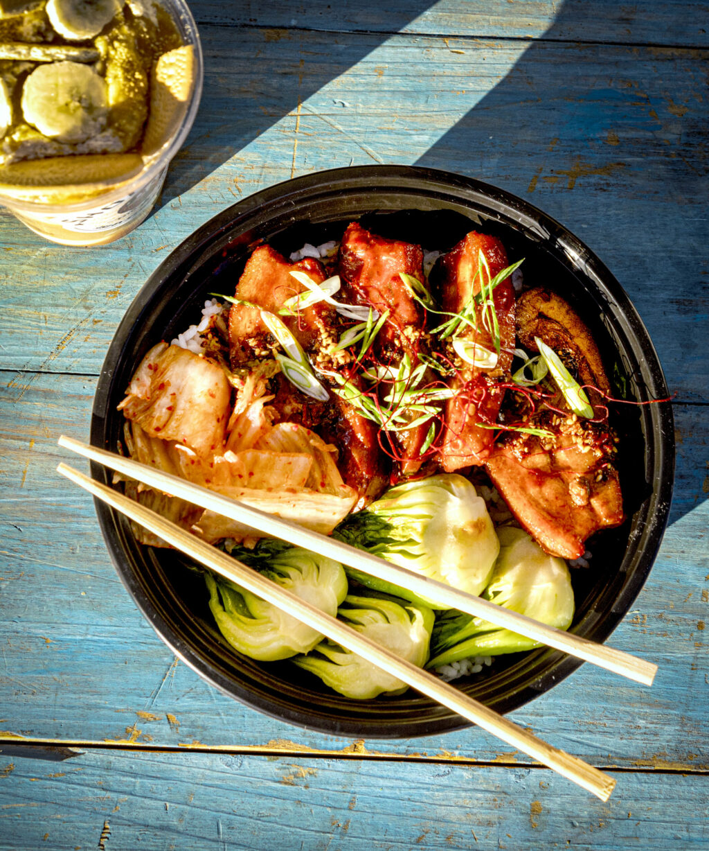 Pork Belly Donburi with kimchi, bok choy and bang bang dip from Shokakko, an Asian street food truck on their regular Thursday night visit Jan. 23, 2025, at Old Caz Beer in Rohnert Park. (John Burgess / The Press Democrat)