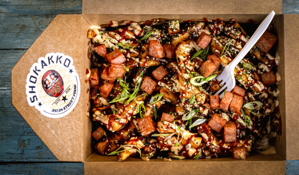Kamikaze Fries with Mae Ploy mayo, Gochujang glaze, scallions and furikake with crispy cubes of fried spam from Shokakko, an Asian street food truck on their regular Thursday night visit Jan. 23, 2025 at Old Caz Beer in Rohnert Park. (John Burgess / The Press Democrat)
