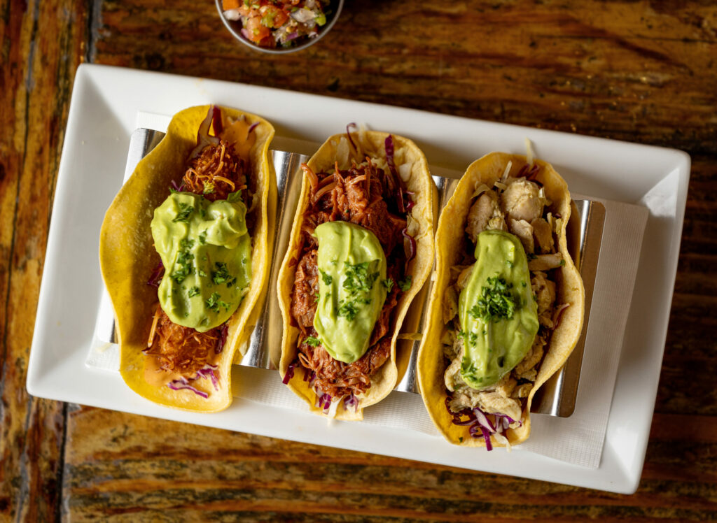 From left, Tacos of Jackfruit, Coconut Plaintain and Tomatillo Chicken from Speakeasy Friday, February 7, 2025, in Petaluma. (John Burgess / The Press Democrat)