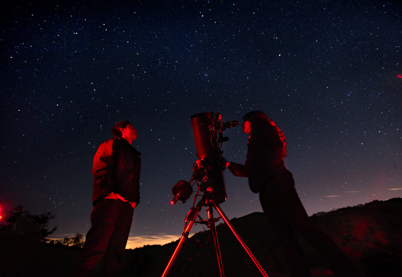 Santa Rosa Junior College astronomy students Marcos Indalecio, left, and Melanie Queiroz view the stars through a telescope belonging to amateur astronomer Dickson Yeager during the monthly public viewing night at the Ferguson Observatory in Sugarloaf Park. In addition to three permanent large telescopes, members of the observatory often bring their personal scopes for the public to enjoy.