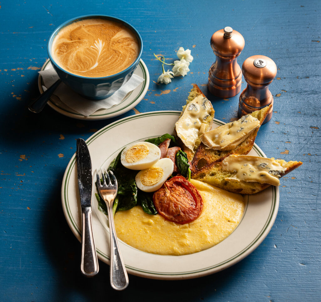 The Market Plate with sautéed spinach, copper, roasted tomatoes, hard boiled egg creamy polenta and cambozola toast from Willow Wood Market Cafe Wednesday March 6, 2024, in Graton. (John Burgess/The Press Democrat)