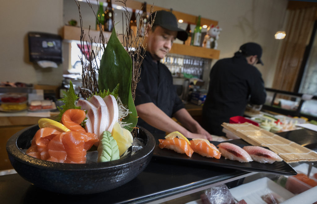 Edwardo Tejeda creates sushi platters at Ume Japanese Bistro in Windsor. (John Burgess/The Press Democrat)