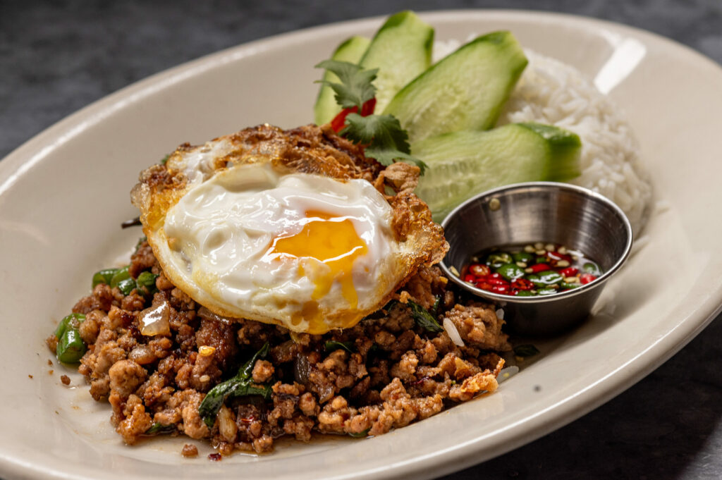 Pad Grapao Moo with spicy stir fried ground pork, long beans, Thai-style fried egg, prik nam pla and jasmine rice from Underwood Bar and Bistro Friday, March 21, 2025, in Graton. (John Burgess / The Press Democrat)