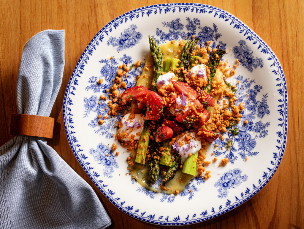 Asparagus Salad with local strawberries, whipped feta, espelette, almonds and lemon curd citronette from Poppy restaurant Thursday, June 12, 2025, in Glen Ellen. (John Burgess / Press Democrat)