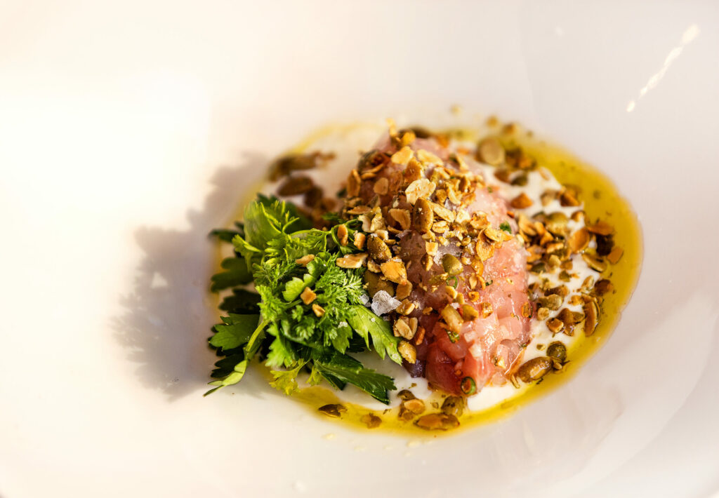 Poisson Cru Frais, a kampachi tartare, chili-citrus crema and fried pumpkin seeds from Poppy restaurant Thursday, June 12, 2025, in Glen Ellen. (John Burgess / Press Democrat)