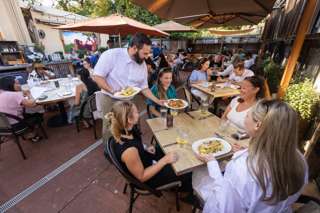 The popular patio at The Girl & The Fig on farmers market night in the Sonoma square Tuesday, July 9, 2024. (John Burgess/The Press Democrat)