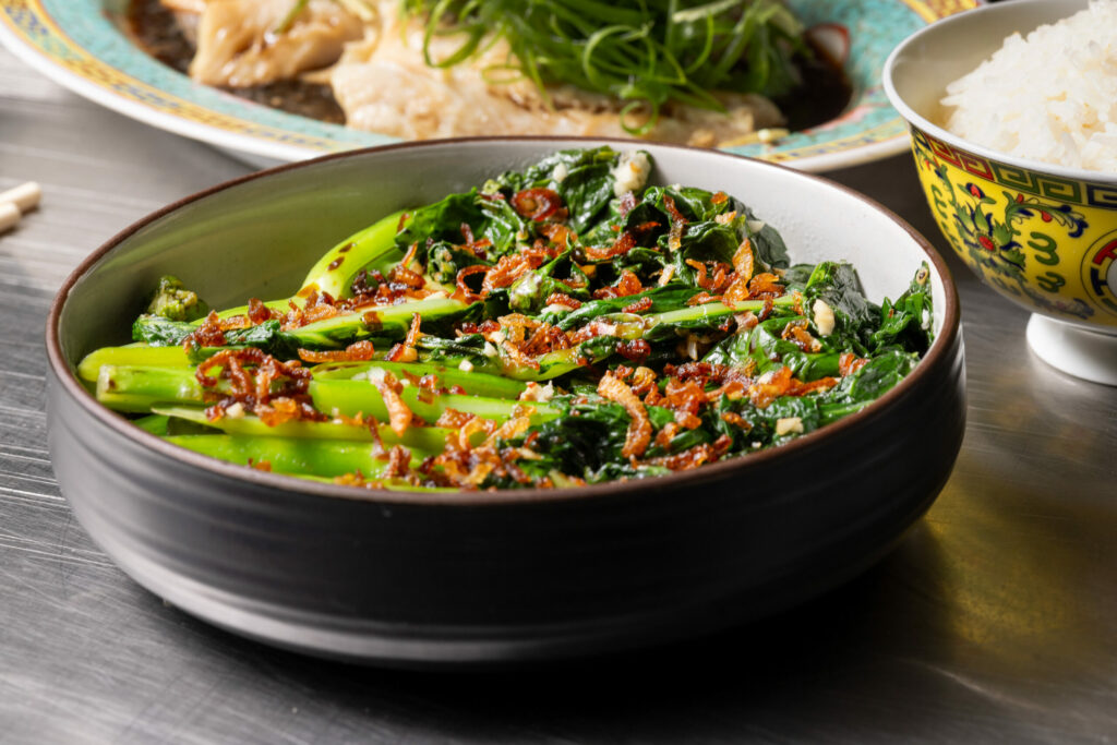 Gai Lan with garlic, sesame, char siu sauce and fried shallots from Bazaar Sonoma, BaSo | Restaurant & Konbini, Oct. 17, 2024, in Forestville. (John Burgess / The Press Democrat)
