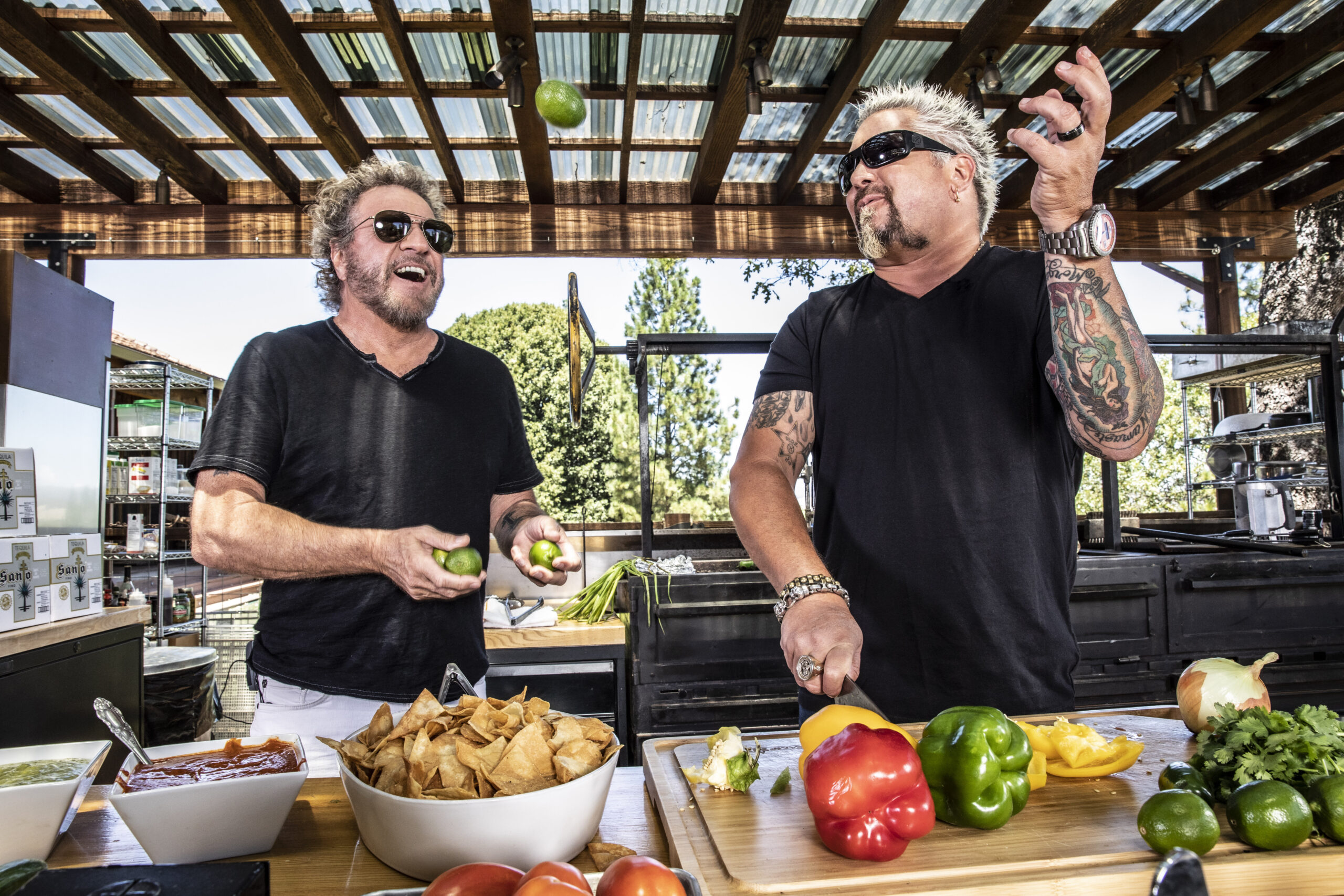 Sonoma County celebrity chef Guy Fieri and rock 'n' roll frontman Sammy Hagar in a promotional image for Santo Tequila, which they founded in 2019. An estimated  million of the tequila was hijacked earlier this month, according to the company. (Santo Tequila)