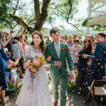 The wedding cake was in the shape of a big, plump chicken. The dress code: “Whatever you can chase chickens in.”