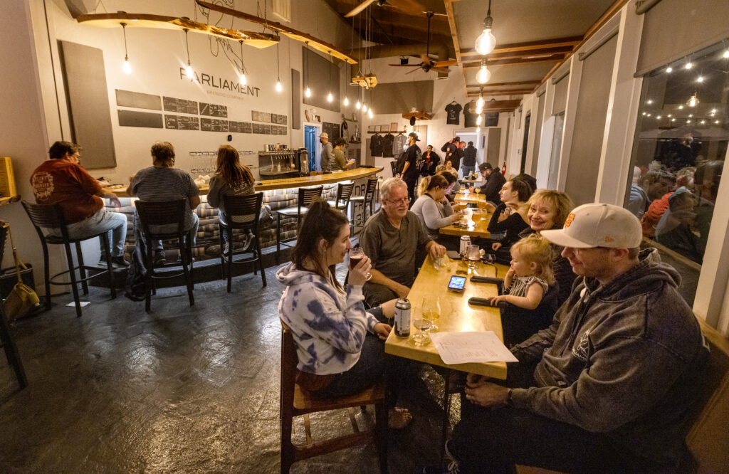 Fans of beer and trivia fill the seats on a Wednesday night at Parliament Brewing Company in Rohnert Park on February, 15, 2022. (John Burgess/The Press Democrat)
