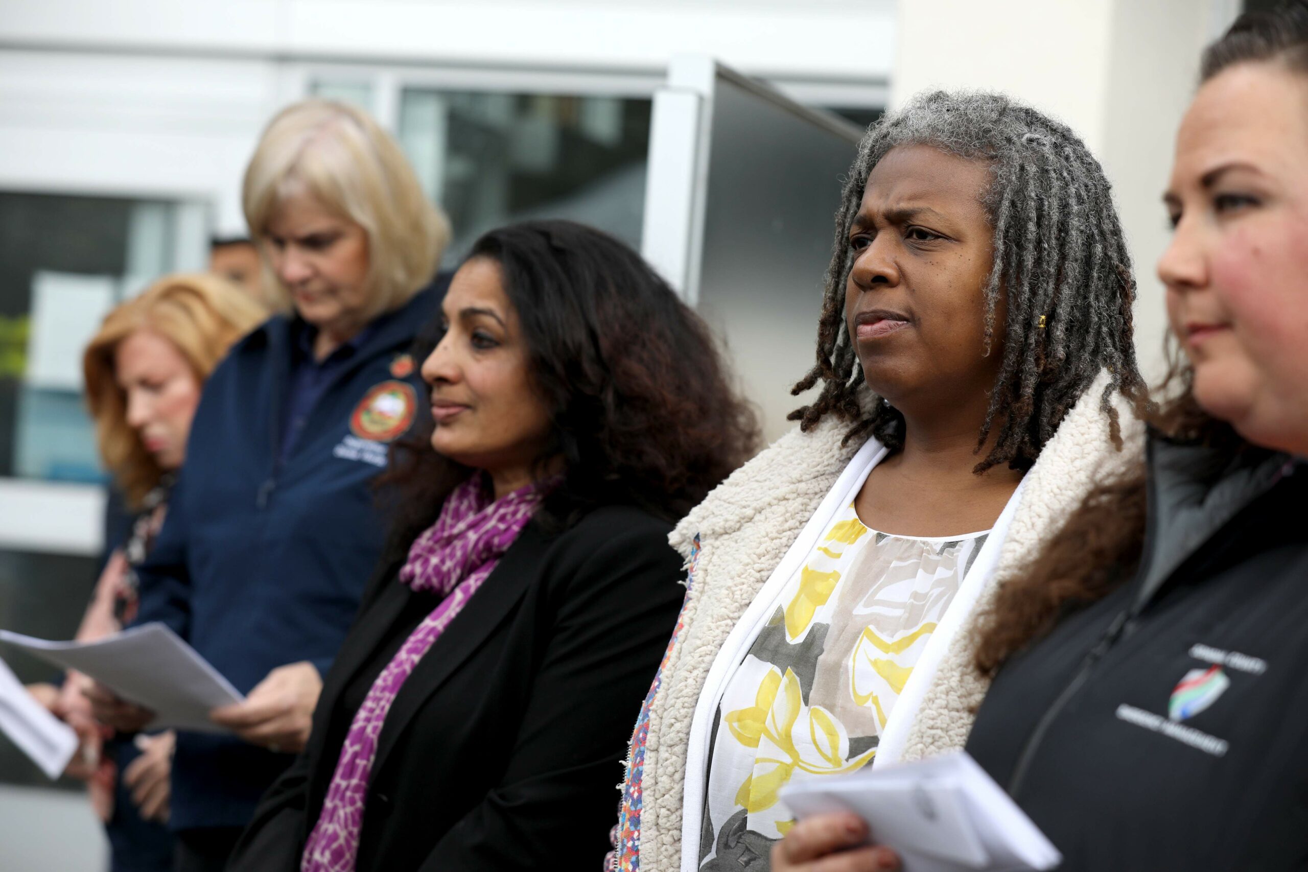 Barbie Robinson, (second from right) the director of the Department of Health Services, attends a press conference about the first community spread case of the coronavirus and the local response. Photo taken outside the Sonoma County administration building in Santa Rosa on Sunday, March 15, 2020. (Beth Schlanker / The Press Democrat)