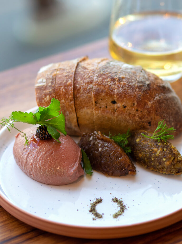 Chicken liver mousse, onion jam and quince paste with housemade sourdough at Troubadour in Healdsburg. (Heather Irwin/Sonoma Magazine)