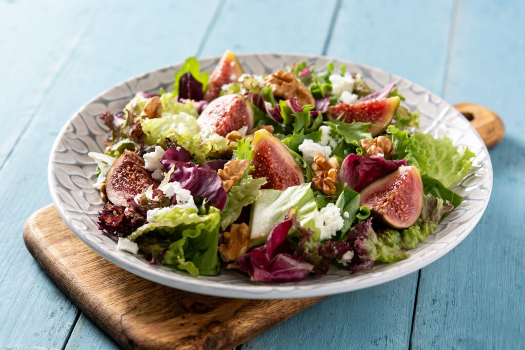 Fig salad with feta cheese and walnuts. (etorres / Shutterstock)