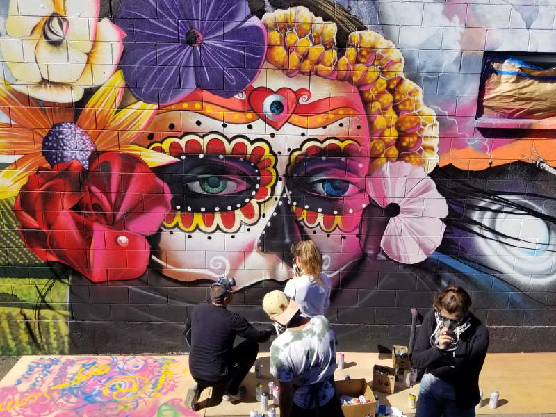 The 15-by-60-foot "Vida de la Muerte" mural in Sonoma, created by nearly 20 teens and organized by the Sonoma Valley Museum of Art, covers the wall of the Republic of Thrift shop in Boyes Hot Springs. (Lorna Sheridan)