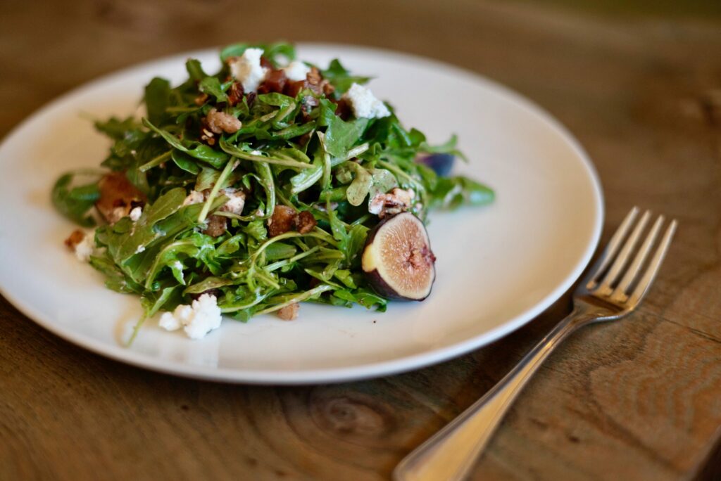 Fig and arugula salad with toasted pecans, pancetta, Laura Chenel chevre and a fig and port vinaigrette at The Girl & The Fig restaurant in Sonoma. (Erik Castro/for The Press Democrat)